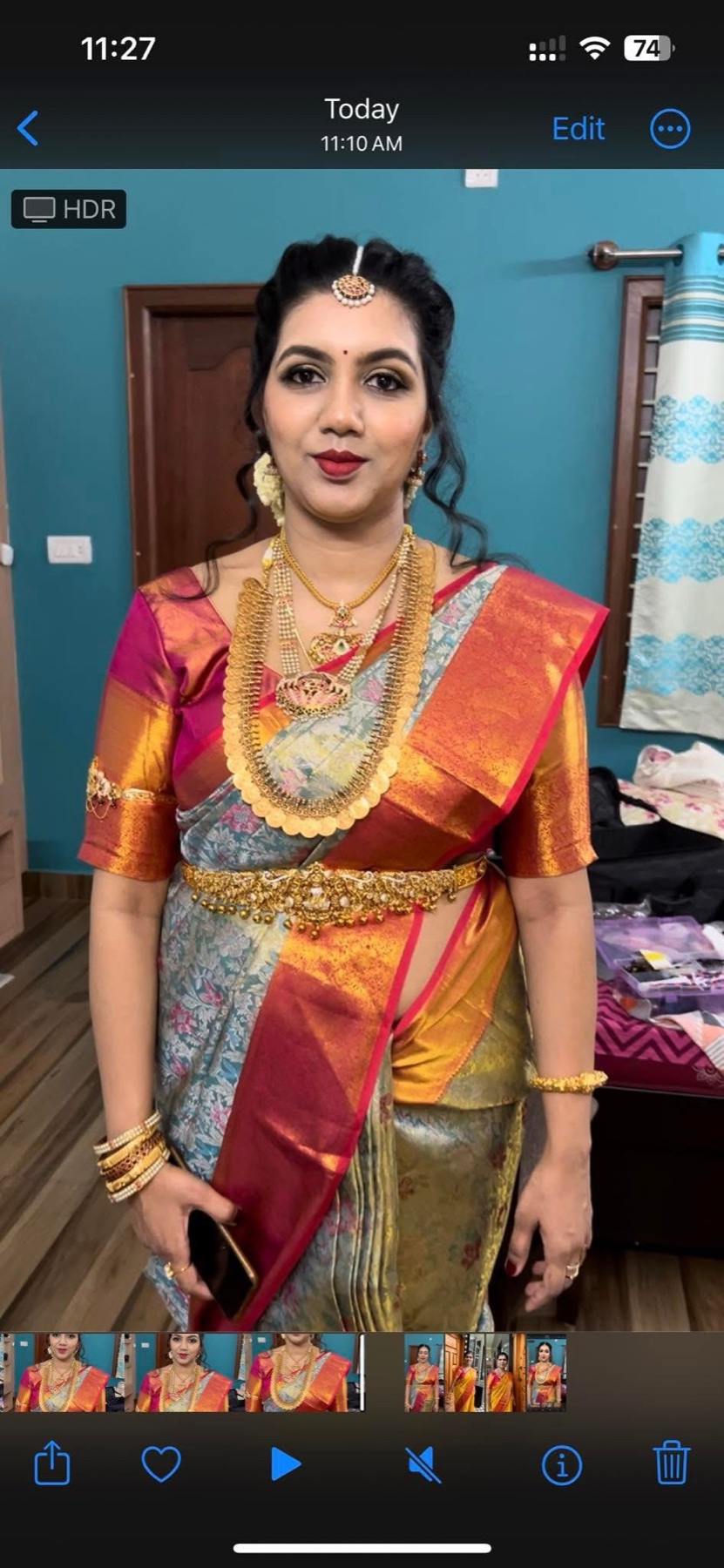 Traditional saree makeup with smoky eyes, a rich red lip and an elegant updo