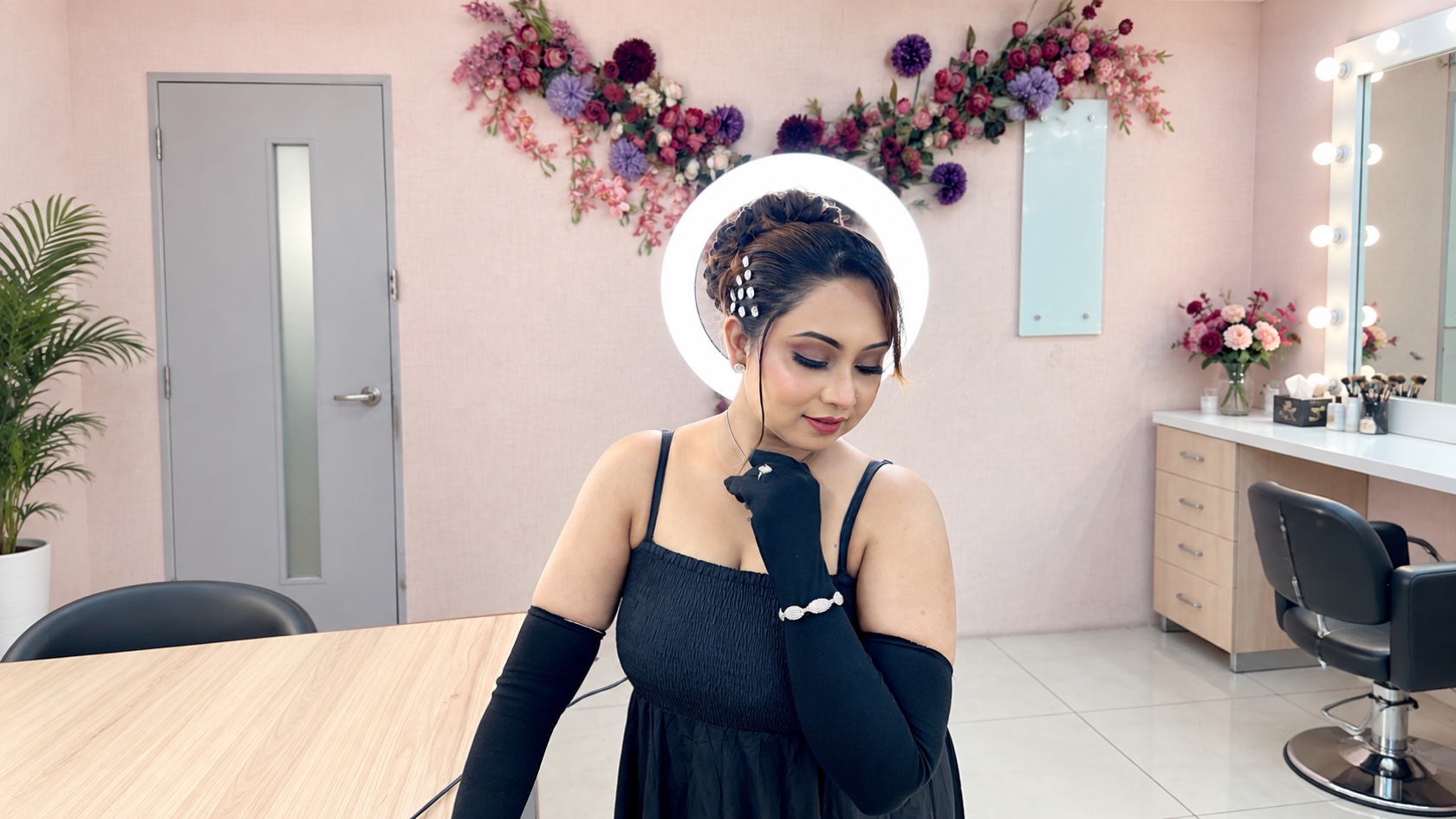 Client in a black evening look with soft makeup and an elegant updo by Ananyaz Makeover